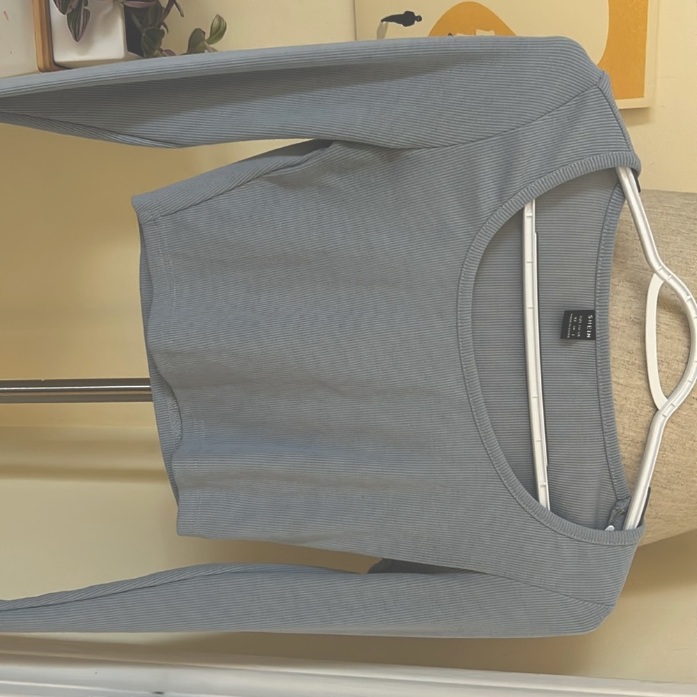 Long sleeve blue crop top. worn twice it is very flattering